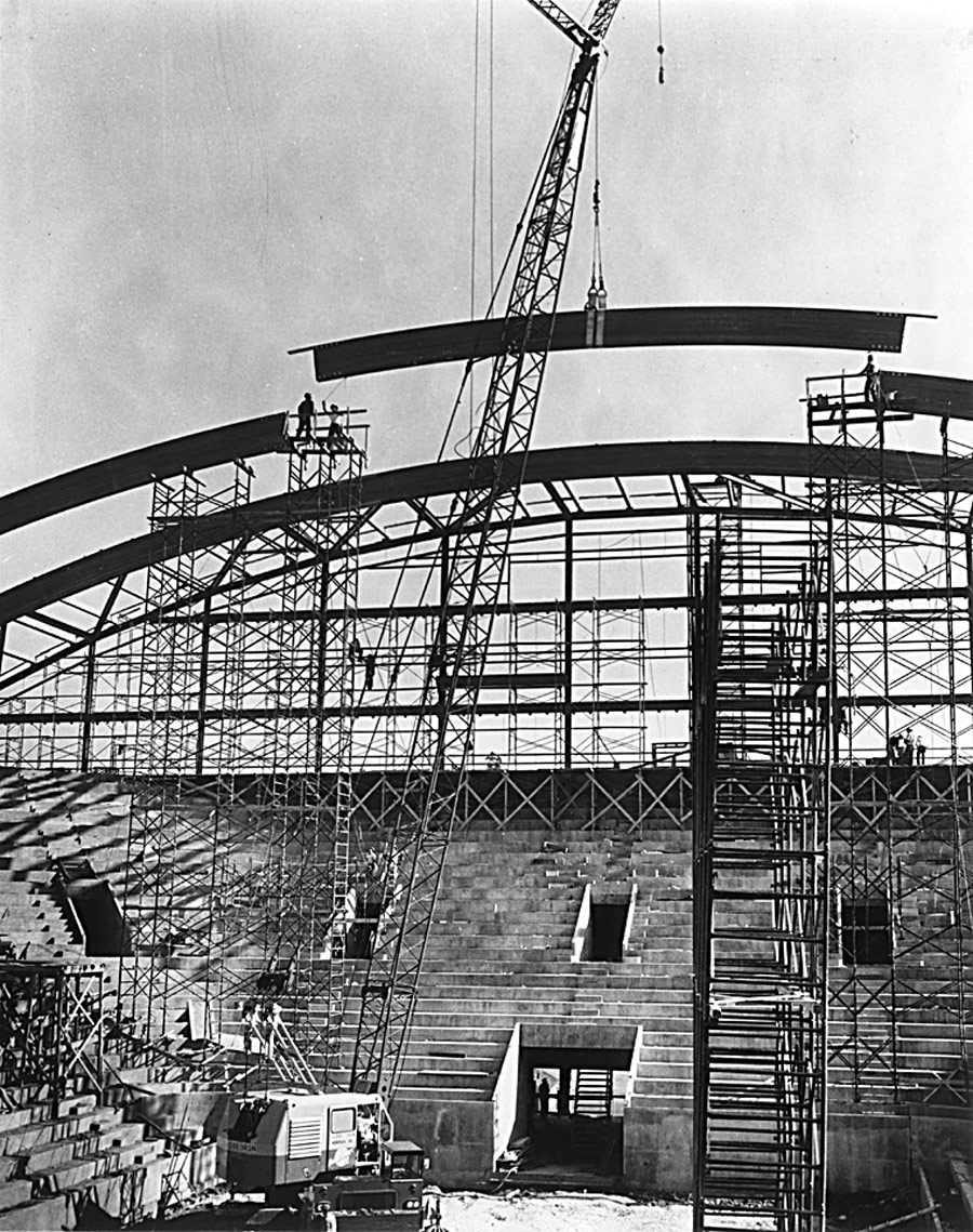 Cassell Coliseumin construction with crane lifting steel beams